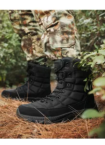 Detail view of durable rubber sole and high-top hiking boots on forest floor