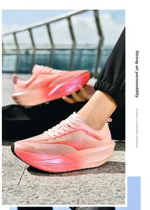 Close-up of pink breathable mesh running shoes with thick cushioned soles on stone steps
