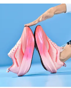 Detailed view of pink gradient breathable mesh upper and cushioned midsole on sneakers