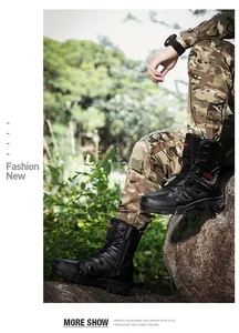 Outdoor close-up of men's black high-top tactical boots with anti-slip rubber outsoles