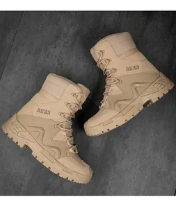 Detailed top view of breathable sand tactical boots with non-slip rubber soles on stone floor