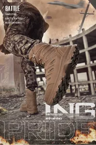 Close-up of high-top desert tactical boots with deep-tread rubber soles for outdoor climbing