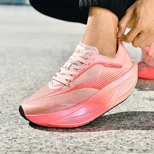 Lace-up breathable running shoes in pink and orange gradient with thick cushioned soles
