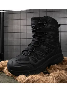Detail of high-top tactical boots with leather and mesh panels on rugged industrial background