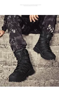 Close-up of black tactical outdoor boots with durable leather and non-slip rubber soles