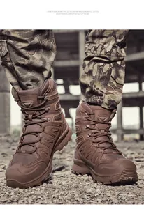 Detailed view of high-top tactical outdoor boots with non-slip sole in rugged terrain