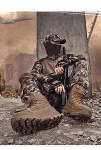 Low-angle shot of durable brown tactical boots with deep tread for outdoor climbing