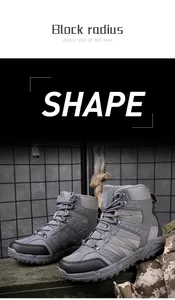 Macro shot of grey tactical hiking boots with mesh paneling and anti-collision toe cap