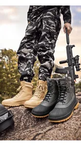Detail of high-top tactical hiking boots with non-slip rubber soles in outdoor terrain