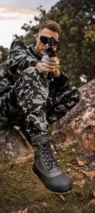 Tactical hiking boots featuring high-top design and reinforced toe for rugged terrain