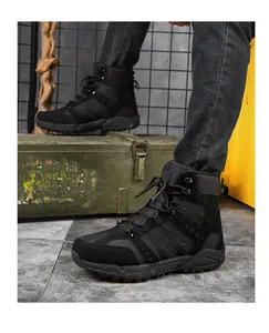 Detail of black tactical combat boot with non-slip rubber sole on outdoor background