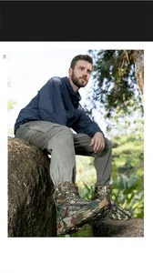 Close-up of camouflage tactical combat boots with high-top lace-up design in the wild