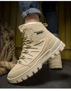 Detail of khaki outdoor tactical boots with anti-slip rubber soles and durable suede mesh