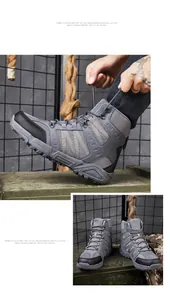Close-up of tactical hiking boots with non-slip deep tread and AS33 logo detail