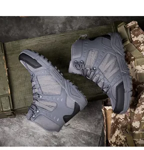 Close-up of tactical hiking boots with breathable mesh, leather upper and grip rubber sole