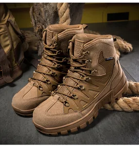 Close-up of brown tactical boots with durable rubber soles on rugged outdoor gear