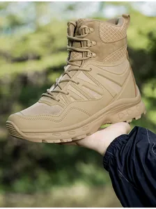 Detail view of khaki tactical boot with breathable mesh panels and non-slip rubber sole