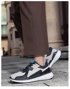 Macro side view of casual sneakers with multi-material paneling on a city street