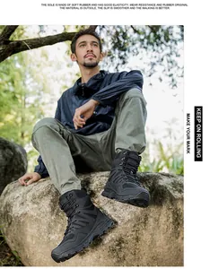 Detail view of high-top tactical boots with rubber outsole for outdoor trekking and combat