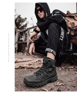 Detail shot of black outdoor tactical boots featuring anti-slip rubber lug soles and laces