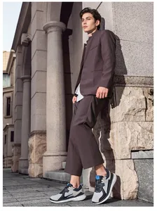 Classic outdoor casual men's sneakers paired with a dark brown business leisure suit set