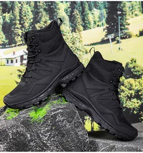 Close-up of black high-top tactical boot with anti-slip rubber sole on mossy rock