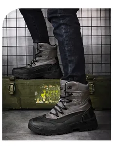 Macro detail of men tactical combat boot with grey mesh, leather and anti-slip sole