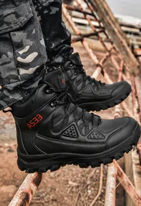 Side view of black high-top tactical boots with A533 logo on industrial background