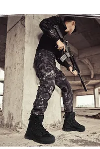 Men's high-top tactical boots with side zipper shown in a rugged industrial outdoor setting