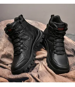 Detail view of black high-top tactical boots featuring side zipper and non-slip rubber soles