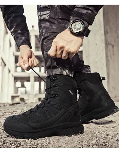 Close-up of black high-top tactical boots with side zipper and AS33 logo in outdoor setting