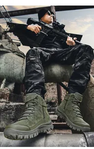 Detail of army green tactical boots with metal side zipper and high-traction rubber outsole