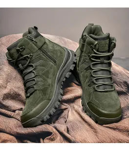 Detail of olive green tactical boots showing side zipper, suede panels and durable rubber sole