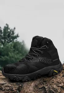 Detail of high-top hiking boot with mesh panels and rugged non-slip rubber outsole