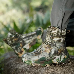 Men's high-top camouflage tactical outdoor boots on a forest rock for training
