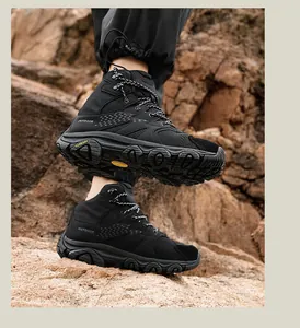 Detail of hiking boot rubber outsole with deep lugs on rocky outdoor terrain
