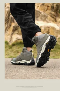 Detailed low-angle shot of durable outdoor hiking boots with deep traction rubber soles