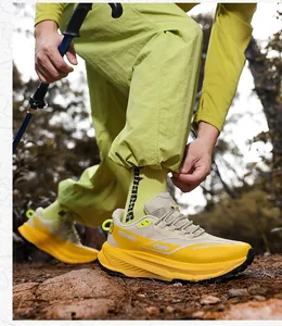 Close-up of thick cushioning sole and rugged tread on outdoor trail running shoes