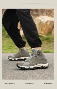Close-up of hiking boots with thickened heel and deep non-slip traction soles on rocks
