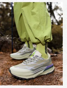 Outdoor trail running shoes with cushioning soles worn by a male model in the forest