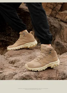 Macro detail of khaki outdoor hiking boots with mesh paneling and non-slip rubber soles