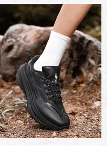 Close-up of FABR black outdoor sneakers with mesh upper and thick cushioned soles