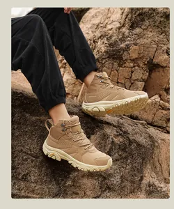 Detail of khaki hiking boots with anti-slip rubber soles and breathable mesh panels