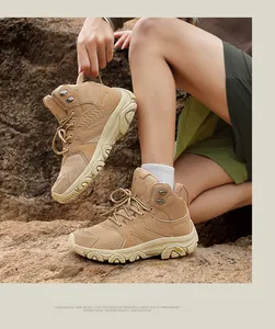 Detail view of khaki hiking boots featuring deep traction soles and breathable mesh