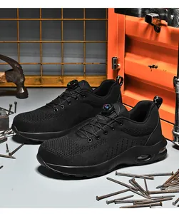 Detail of safety shoe with steel toe, mesh upper, air cushion, and dial lacing system