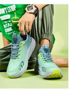 Detail of teal and mint green breathable mesh running shoes with thick cushioned soles