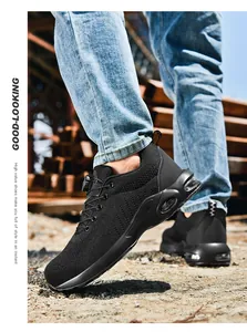 Detail view of black safety shoes with steel toe, air cushion sole and rotary lace system