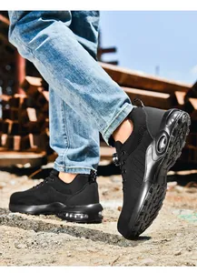 Detail shot of black safety shoes with rotary buckle system and air cushion sole in action