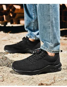 Detail of safety shoe featuring breathable mesh, steel toe and rotary buckle closure
