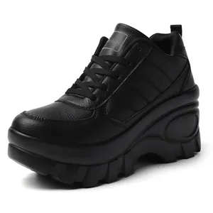 Women's black platform sneakers with heart relief detail and 8cm thick wedge sole